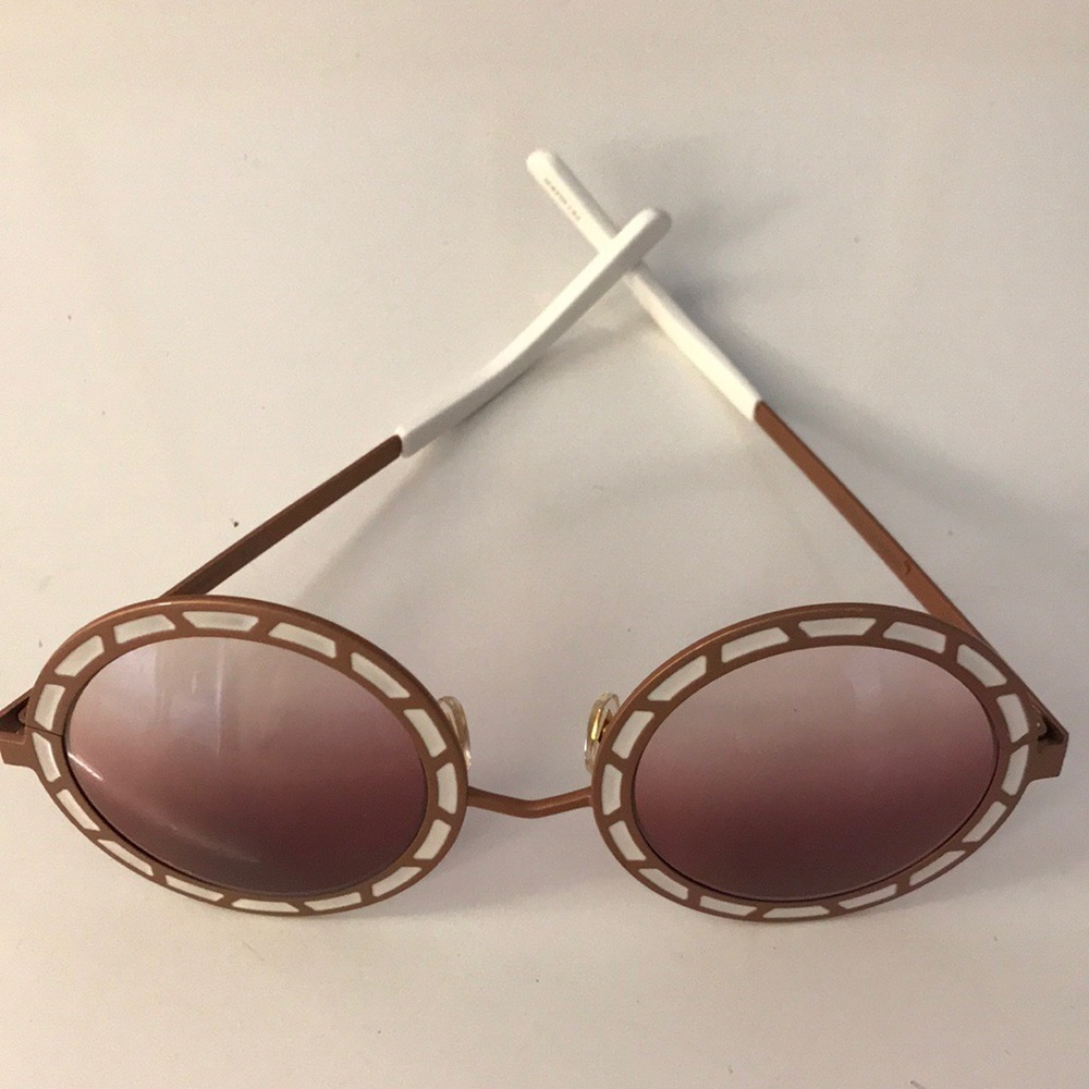 Pared Sonny and Cher sunglasses